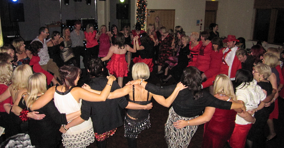 Guests dancing at a disco at Mere Brow Village Hall, near Southport / Preston